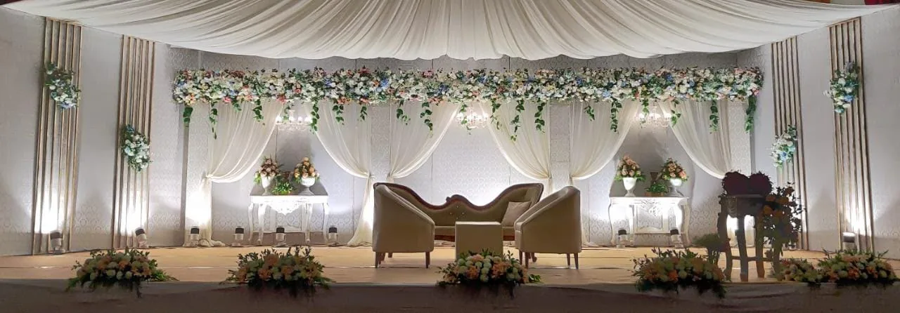 White draped wedding stage